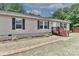 A welcoming single-story home with a brick walkway and well-maintained landscaping at 119 Marietta Rd, Mooresville, NC 28117