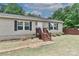 A well-maintained single-story home with manicured landscaping and front porch at 119 Marietta Rd, Mooresville, NC 28117