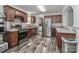 Modern kitchen featuring stainless steel appliances, ample cabinetry, and stylish countertops at 119 Marietta Rd, Mooresville, NC 28117