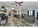 Spacious living area and kitchen featuring hardwood floors and modern appliances and furniture at 119 Marietta Rd, Mooresville, NC 28117