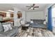 Bright living room featuring hardwood floors, modern furniture, and an open layout flowing into the kitchen at 119 Marietta Rd, Mooresville, NC 28117