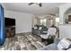 Inviting living room with modern sofas, ceiling fans, and stylish flooring at 119 Marietta Rd, Mooresville, NC 28117