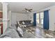 Comfortable living room with ceiling fan, stylish floors, and plenty of natural light at 119 Marietta Rd, Mooresville, NC 28117