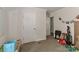 A neutral carpeted room features neutral walls with white trim and a play area at 119 Marietta Rd, Mooresville, NC 28117