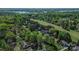 Panoramic aerial view of neighborhood with manicured golf course, lake, and green space at 136 Wood Duck Loop, Mooresville, NC 28117