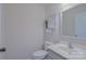 Bathroom with a commode, vanity, and mirror at 136 Wood Duck Loop, Mooresville, NC 28117