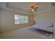 Sunlit bedroom featuring neutral walls and flooring at 136 Wood Duck Loop, Mooresville, NC 28117