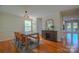 Bright dining room featuring hardwood floors, modern lighting, and elegant decor at 136 Wood Duck Loop, Mooresville, NC 28117
