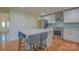 Spacious kitchen featuring an island with barstools and stainless steel appliances at 136 Wood Duck Loop, Mooresville, NC 28117