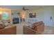 Cozy living room with a fireplace and television at 136 Wood Duck Loop, Mooresville, NC 28117