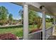 Inviting porch with white columns overlooking a meticulously maintained front yard at 136 Wood Duck Loop, Mooresville, NC 28117