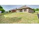 Spacious backyard with lush green grass, a fenced perimeter, and access to the screened porch at 14113 Highland Meadow Rd, Charlotte, NC 28273