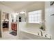 Bright bathroom featuring a soaking tub, vanity with granite countertop, and natural light at 14113 Highland Meadow Rd, Charlotte, NC 28273