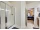 Bathroom featuring a glass-enclosed shower and tile flooring, leading to the bedroom at 14113 Highland Meadow Rd, Charlotte, NC 28273