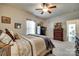 Bedroom with carpet, neutral paint, ceiling fan, gun safe and a large bed at 14113 Highland Meadow Rd, Charlotte, NC 28273