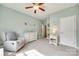 Well-lit bedroom with carpet, neutral paint, ceiling fan, and white trim at 14113 Highland Meadow Rd, Charlotte, NC 28273