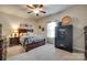 Bedroom with carpet, neutral paint, ceiling fan, gun safe and a large bed at 14113 Highland Meadow Rd, Charlotte, NC 28273