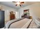 Bedroom with carpet, neutral paint, ceiling fan, with hardwood floors in the hall at 14113 Highland Meadow Rd, Charlotte, NC 28273