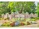 Beautiful Kingsbridge community entrance sign surrounded by colorful flowers and greenery at 14113 Highland Meadow Rd, Charlotte, NC 28273