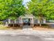 Community pool house with trees in front of pool offering a great spot for residents at 14113 Highland Meadow Rd, Charlotte, NC 28273