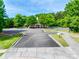 Community pool parking lot with landscaped surroundings offering a great place for relaxation and recreation at 14113 Highland Meadow Rd, Charlotte, NC 28273