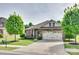 Charming single-Gathering home with a well-manicured front yard and attached two-car garage at 14113 Highland Meadow Rd, Charlotte, NC 28273