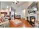 Inviting living room features a fireplace, hardwood flooring, and open layout connecting to other living spaces at 14113 Highland Meadow Rd, Charlotte, NC 28273