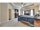 Comfortable main bedroom featuring a dresser, TV, and a bed with a plush duvet beneath a tray ceiling at 14113 Highland Meadow Rd, Charlotte, NC 28273