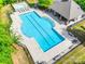 Aerial view of a luxurious, modern pool complete with lap lanes and separate leisure area at 14113 Highland Meadow Rd, Charlotte, NC 28273