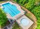 Aerial view of a luxurious pool with a separate lounge area and jacuzzi tub at 14113 Highland Meadow Rd, Charlotte, NC 28273
