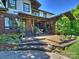 Multi-tiered back porch with brick features and a view of the back yard at 1413 Devon Dr, Charlotte, NC 28209