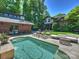 Stunning backyard featuring a sparkling pool and an elegant patio for outdoor entertaining at 1413 Devon Dr, Charlotte, NC 28209