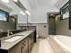 Modern bathroom with double sinks, a soaking tub, and a separate shower provides a luxurious retreat at 1413 Devon Dr, Charlotte, NC 28209