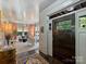 Inviting foyer featuring hardwood floors and a view into the home's bright living spaces at 1413 Devon Dr, Charlotte, NC 28209