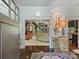 Elegant foyer with hardwood floors, an ornate chest, and an open view to the living and kitchen areas at 1413 Devon Dr, Charlotte, NC 28209