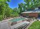 Relaxing pool area with chairs and tables at 1413 Devon Dr, Charlotte, NC 28209