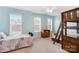 Well-lit bedroom with a bunk bed, carpet, and two windows with lots of natural light at 15324 Yarmouth Rd, Mint Hill, NC 28227