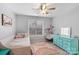 Bright bedroom with light gray walls, ceiling fan, and lots of natural light at 15324 Yarmouth Rd, Mint Hill, NC 28227