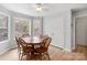 Bright dining room features wood floors, neutral walls, and large windows with natural light at 15324 Yarmouth Rd, Mint Hill, NC 28227