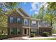 Charming brick and siding home with green shutters and manicured landscaping, front yard at 15324 Yarmouth Rd, Mint Hill, NC 28227