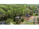 Charming two-story home with brick and siding exterior, mature trees and lush green landscaping at 15324 Yarmouth Rd, Mint Hill, NC 28227