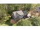 Charming two-story home with brick and siding exterior, mature trees and lush green landscaping at 15324 Yarmouth Rd, Mint Hill, NC 28227