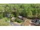 Charming two-story home with brick and siding exterior, mature trees and lush green landscaping at 15324 Yarmouth Rd, Mint Hill, NC 28227