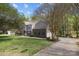 Traditional home with a well-manicured lawn, two-car garage, and beautiful trees at 15324 Yarmouth Rd, Mint Hill, NC 28227