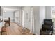 Inviting entryway with wood floors, showcasing a staircase, dining area, and a neutral color palette at 15324 Yarmouth Rd, Mint Hill, NC 28227