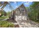 Three car garage exterior with siding and a well maintained yard at 15324 Yarmouth Rd, Mint Hill, NC 28227