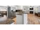 Modern kitchen featuring stainless steel appliances, granite countertops, and breakfast nook seating at 15324 Yarmouth Rd, Mint Hill, NC 28227