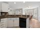 Updated kitchen features granite countertops, white cabinets, and modern appliances, with adjacent dining area at 15324 Yarmouth Rd, Mint Hill, NC 28227