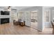 Inviting living room boasts a fireplace, neutral colors, and access to a sunroom with large windows at 15324 Yarmouth Rd, Mint Hill, NC 28227
