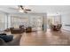 Cozy sun room with wood floors, filled with natural light, offering a peaceful view of the outdoors at 15324 Yarmouth Rd, Mint Hill, NC 28227